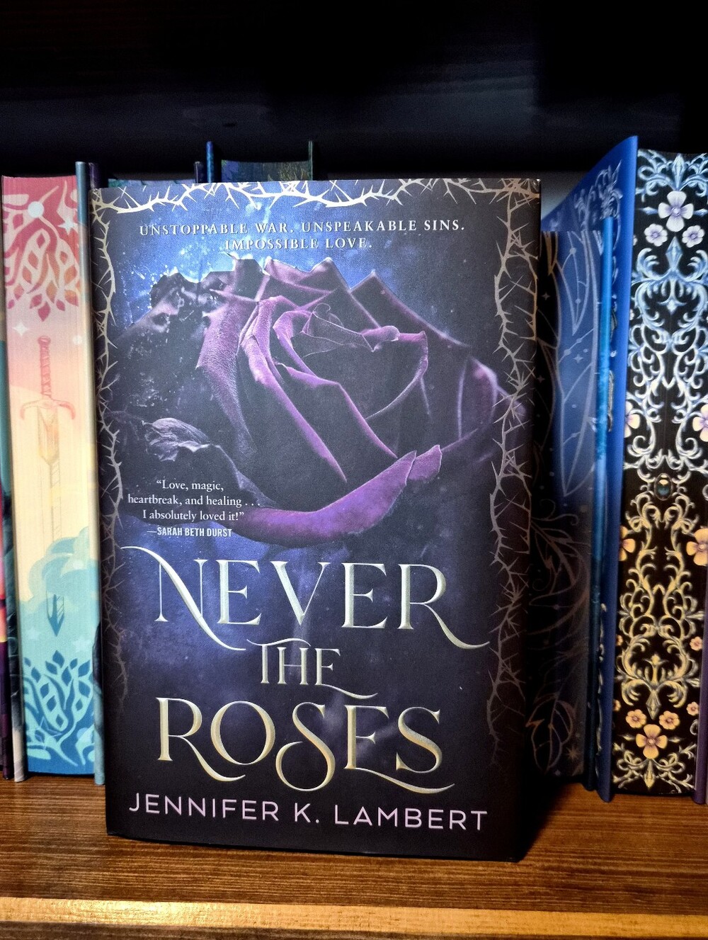 Never the Roses by Jennifer Lambert
